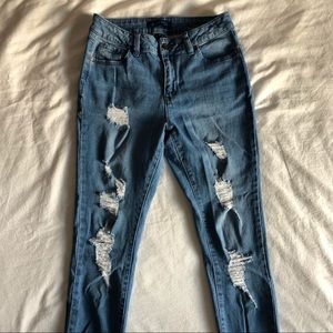 Blue distressed skinny jeans
